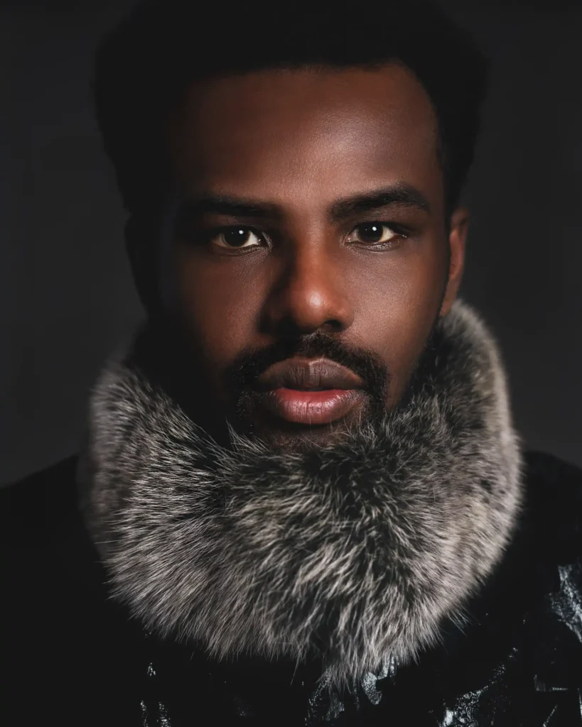 artistic portrait photography of a man with furry coat, dark theme