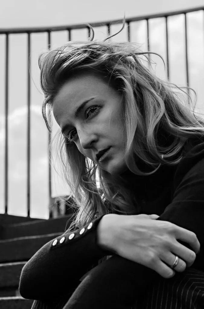 artistic black and white portrait photography of a woman with blond hair made with retro photography lens