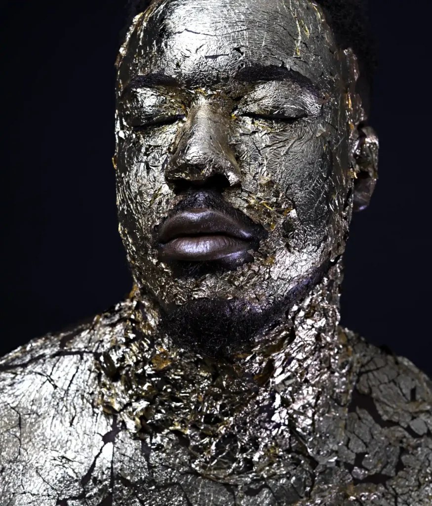 artistic portrait photography of a man with golden skin