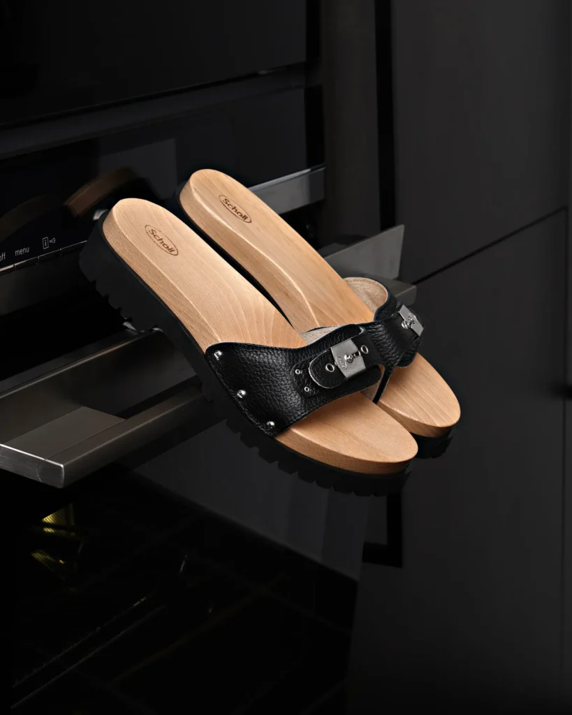 creative inside studio photography of a scholl shoes. close up of a shoes in the kitchen