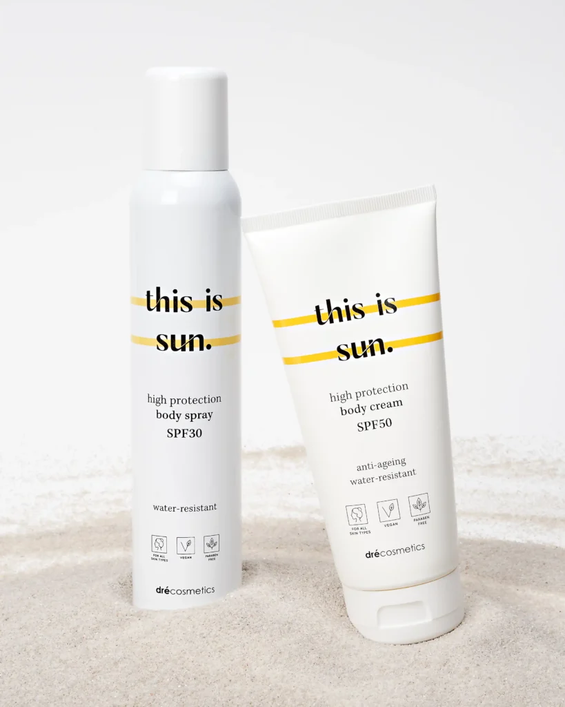 creative product advertising photo with a bottle of a sun cream on the send with a white background