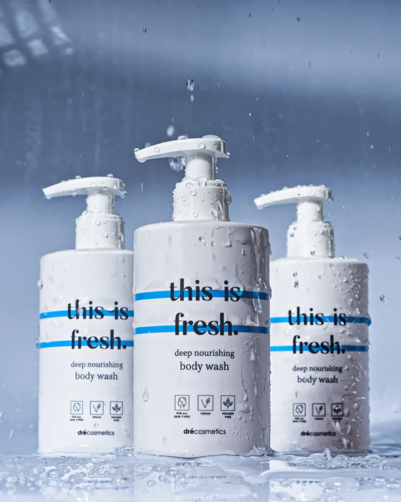 creative product advertising photo with wet dripping water and shower gel cosmetics