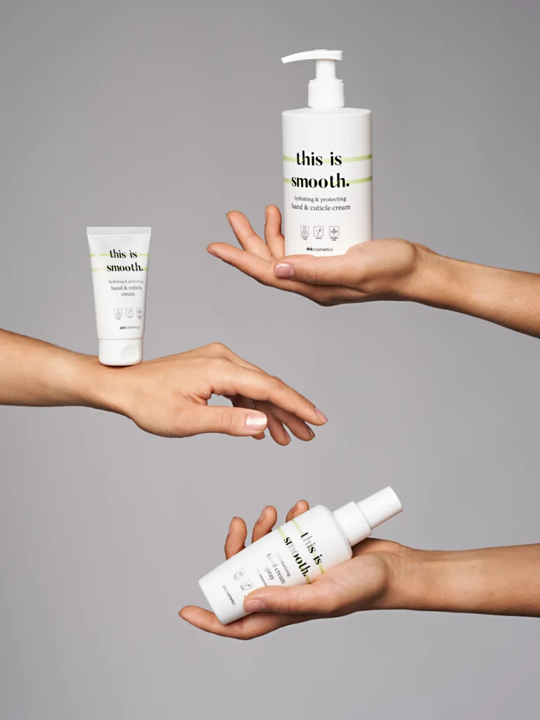 creative product advertising photo with hands holding cosmetic products