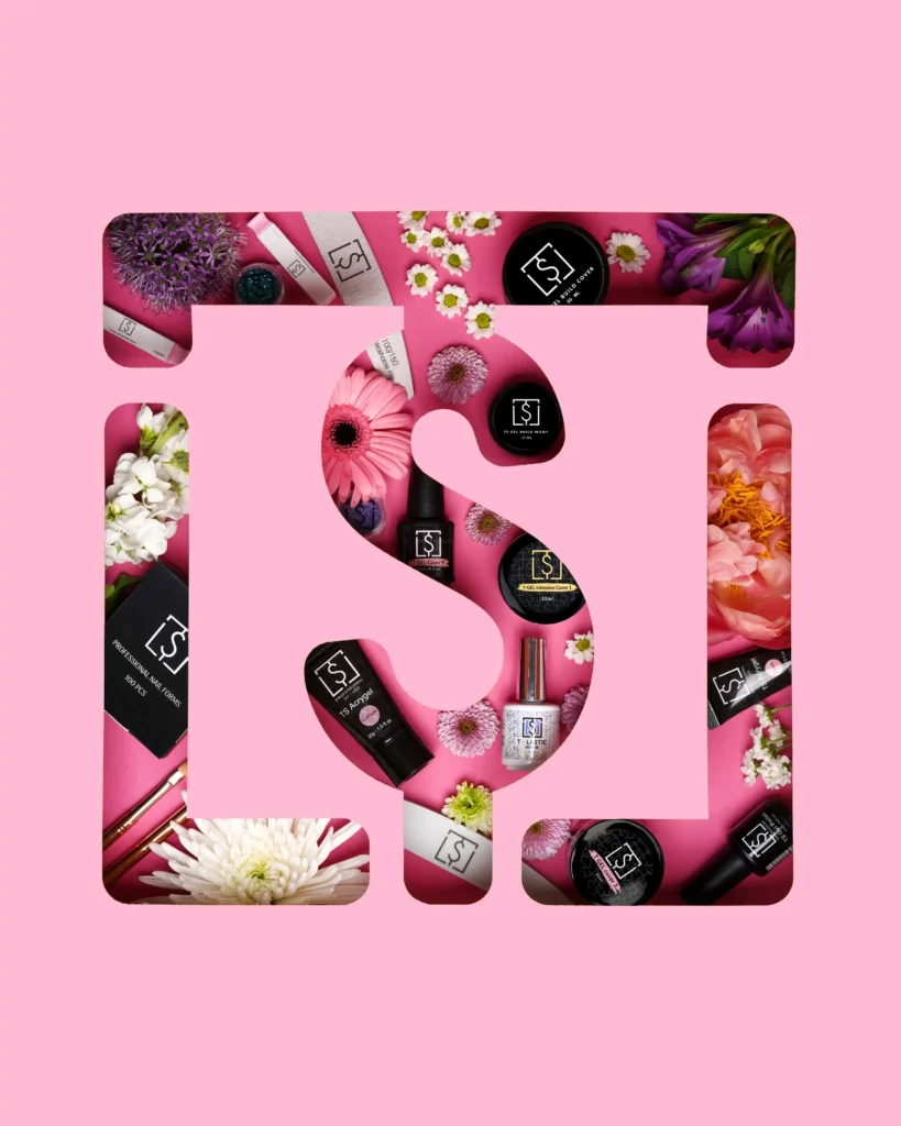 creative still life photography of a cut out logo with nail products and flowers inside the cut out