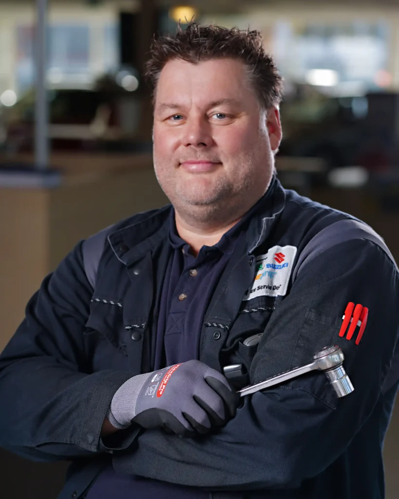 personal branding company portrait of a car mechanic holding a product