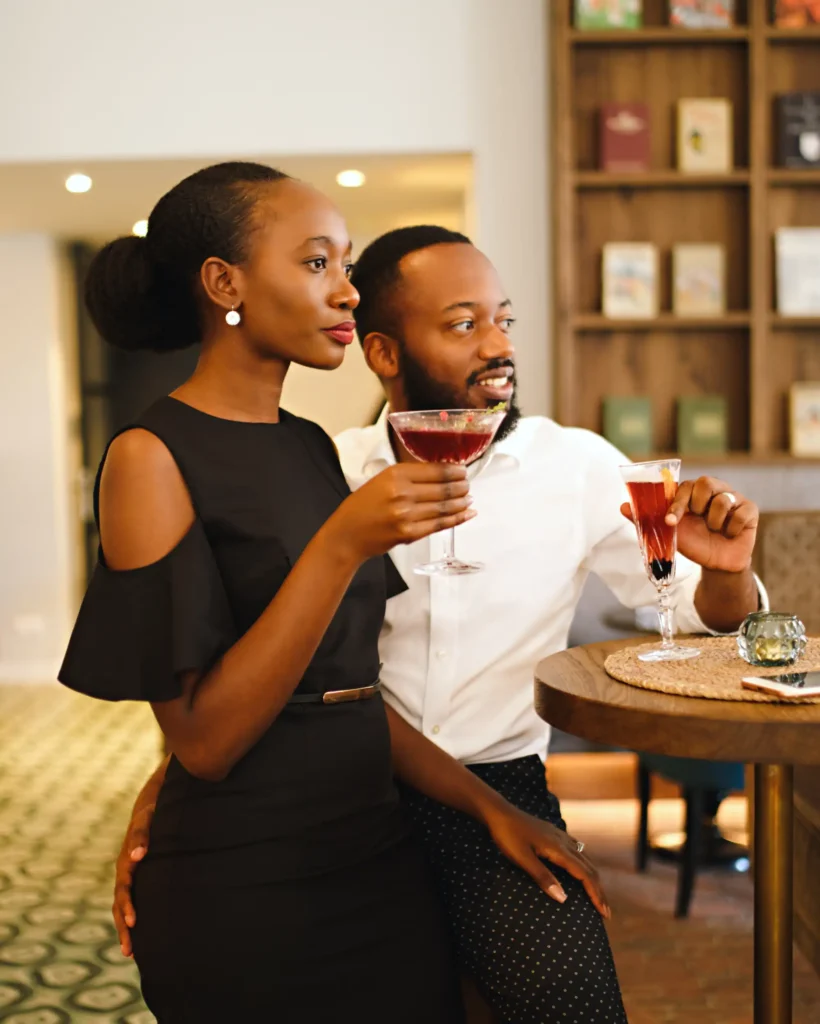 personal branding photography of an influencer with husband standing in a bar