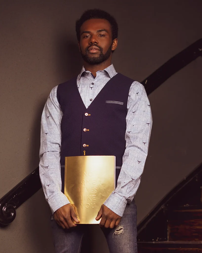 personal branding photography of a hairdresser standing in the salon with a brand merchandise
