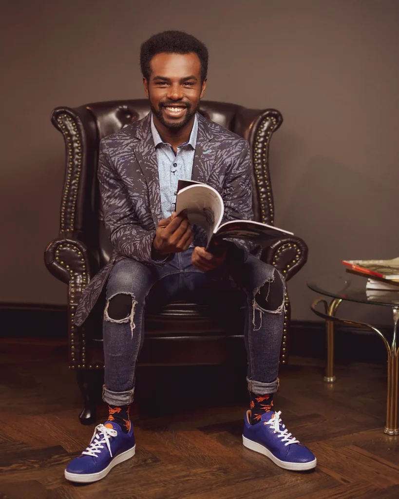 personal branding photography of a hairdresser sitting in the salon with a book