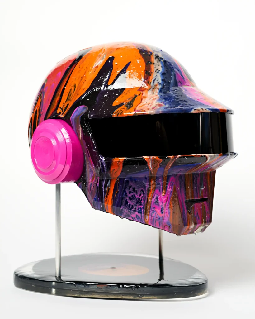 colourful galaxy painting on the art piece replica of a daft punk helmet. Full photo with stand.