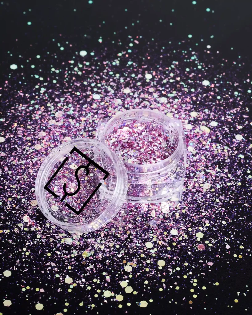 still life Packshot product photography of pink glitter on the back background